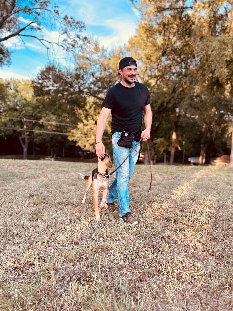 Justin Schaefer walking a trained dog